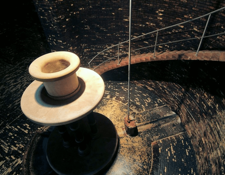 Descending the elegant spiral staircase